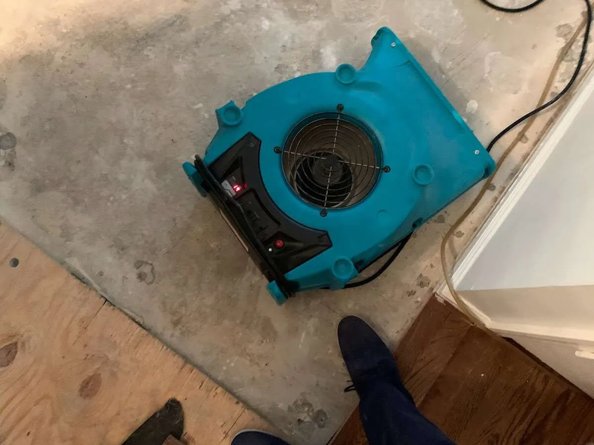 Air mover drying subfloor during Commercial Water Damage Restoration in Stokesdale